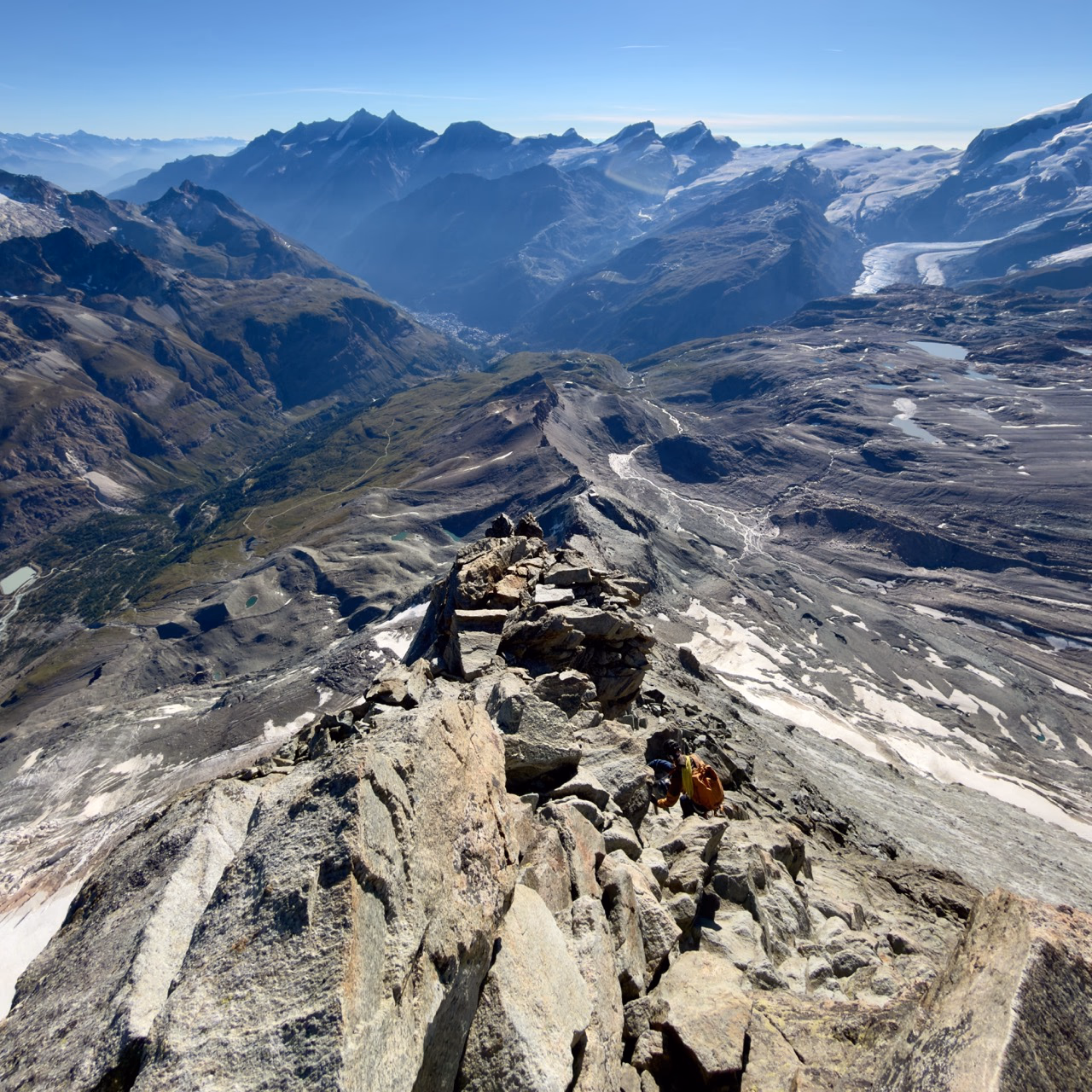 Descending the Hörnli Ridge, with the long road back to Zermatt unfolding below.