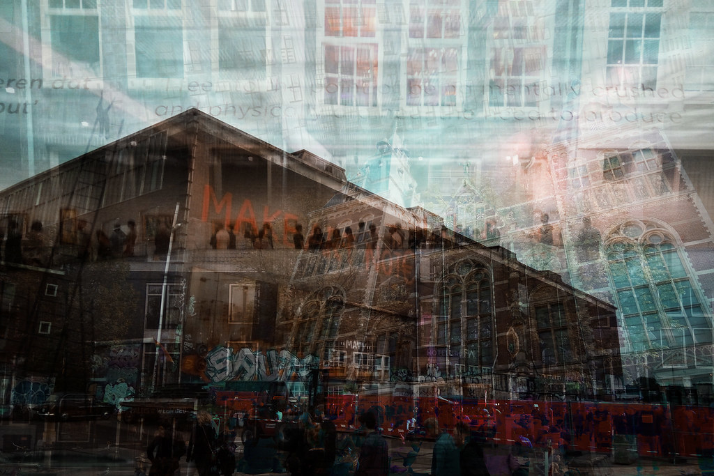 Layered multiple exposure of Amsterdam warehouse, crowd and glazed facade, urban memory collage