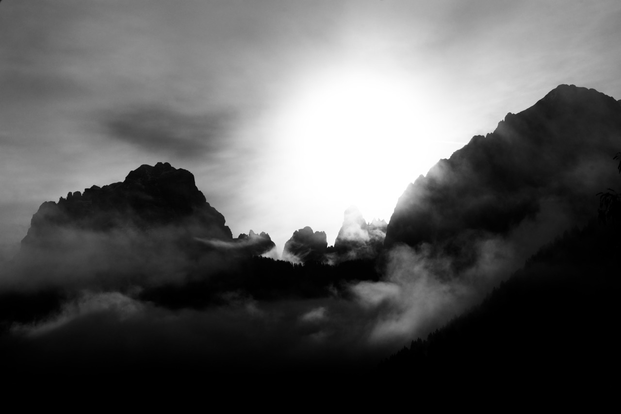 Dramatic storm light over Dolomite towers, digital photography, 2024