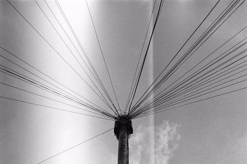 Symmetric power lines, black and white, road junction, Margate, UK