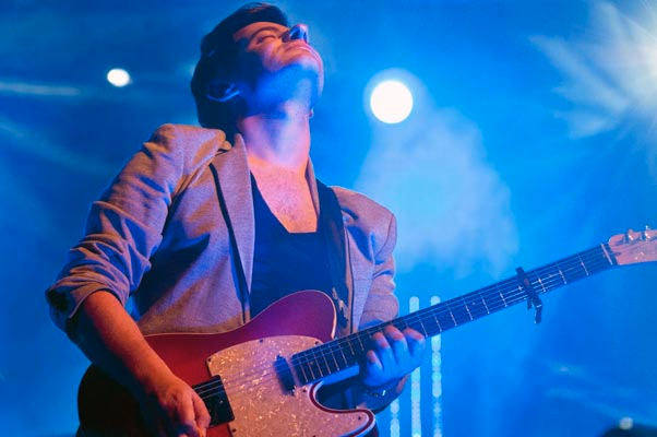 Guitarist looking up into stage lights, Airport Impressions live, Beland Festival, Malta