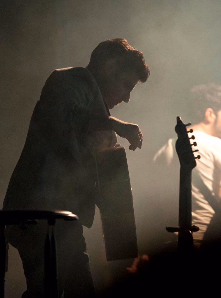Guitarist silhouetted against backlight, Airport Impressions, Beland Festival, Malta