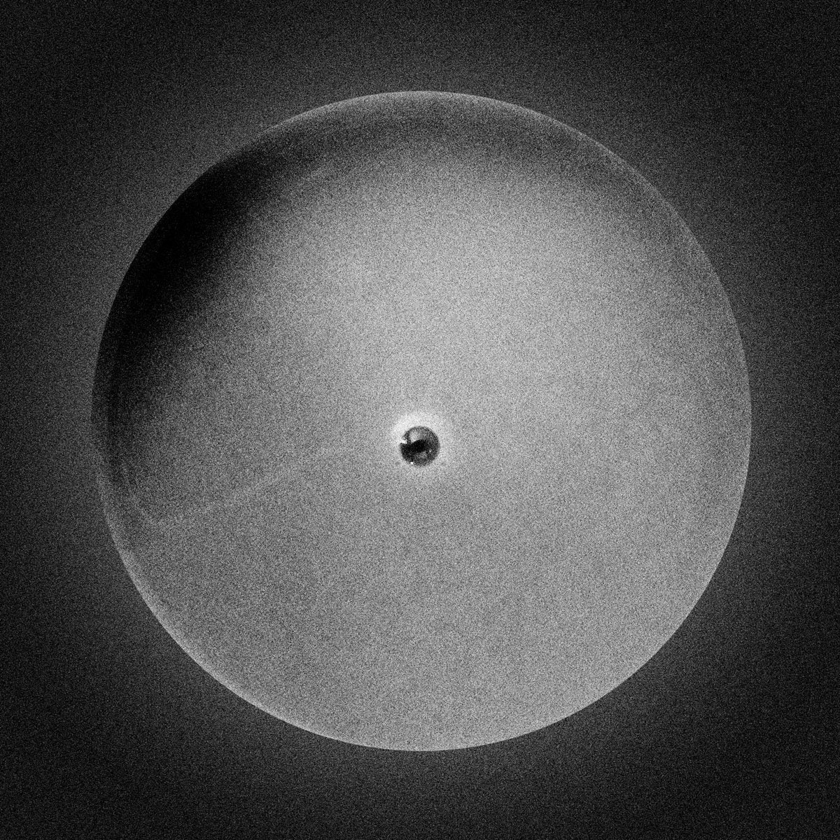 Smooth abstract planet with solitary dark mark, tea residue photograph, digital media, 2013-2016
